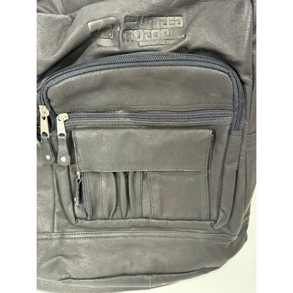 New United Motor Manufacturing Black Leather Backpack Multi Pocket YKK Zipper